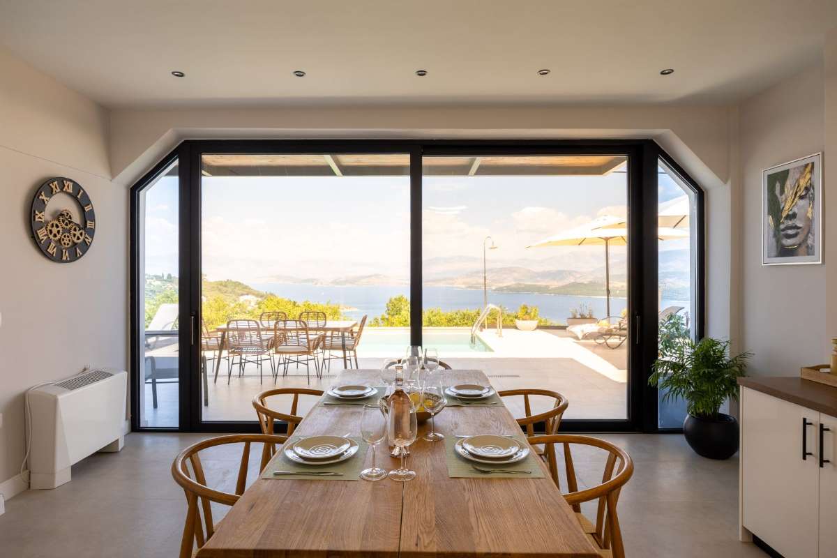 Dining table by the open bifold doors